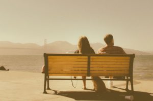 Photo: Couple Sitting on a Park Bench